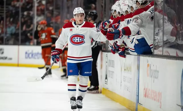 Montreal Canadiens defenseman Lane Hutson celebrates his goal with the bench during the first period of an NHL hockey game against the Anaheim Ducks, Friday, March 6, 2026, in Anaheim, Calif. (AP Photo/Kyusung Gong)