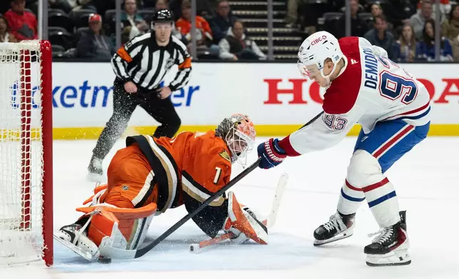 Anaheim Ducks goaltender Lukas Dostal (1) blocks the shot by Montreal Canadiens right wing Ivan Demidov during the second period of an NHL hockey game, Friday, March 6, 2026, in Anaheim, Calif. (AP Photo/Kyusung Gong)