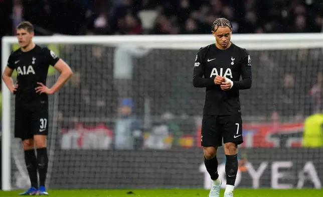 Tottenham's Xavi Simons, right, and Tottenham's Micky van de Ven react at the end of the first leg of the Champions League round of 16 soccer match between Atletico Madrid and Tottenham in Madrid, Spain, Tuesday, March 10, 2026. (AP Photo/Jose Breton)