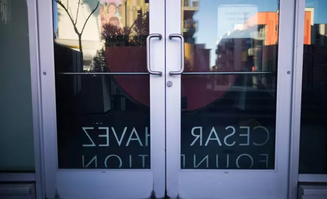 A sign for the Cesar Chavez Foundation sits in the lobby of its office in Los Angeles, Wednesday, March 18, 2026. (AP Photo/Jae C. Hong)