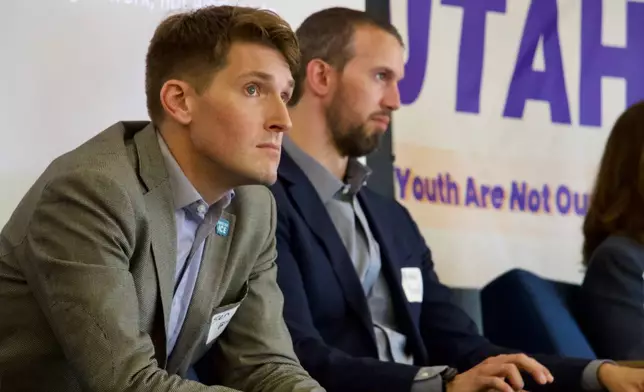 Utah state Sen. Nate Blouin, left, and tax attorney Michael Farrell speak on a panel of candidates running to represent Utah's new Democratic-leaning congressional district, March 21, 2026, in Taylorsville, Utah. (AP Photo/Hannah Schoenbaum)