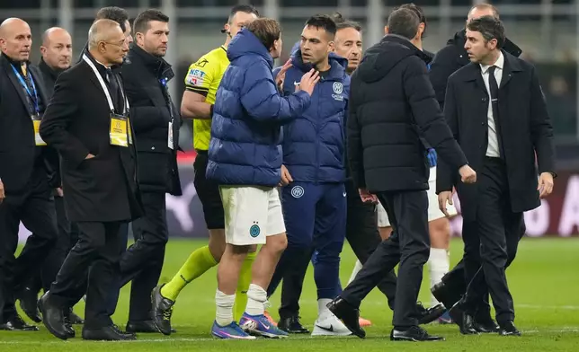 Inter Milan's Lautaro Martinez, centre right, reacts after the Serie A soccer match between AC Milan and Inter Milan, in Milan, Italy, Sunday, March 8, 2026. (AP Photo/Luca Bruno)