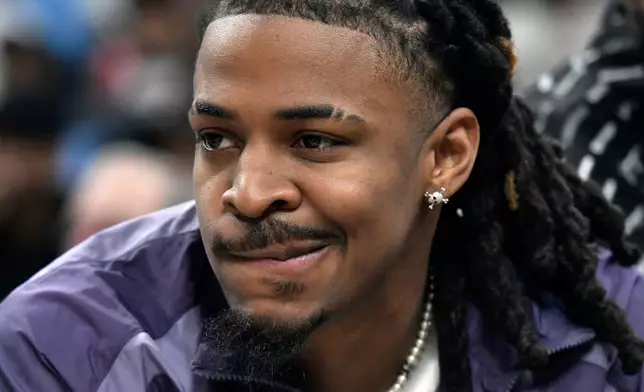 Memphis Grizzlies guard Ja Morant looks on from the bench in the first half of an NBA basketball game against the Los Angeles Clippers Saturday, March 7, 2026, in Memphis, Tenn. (AP Photo/Brandon Dill)
