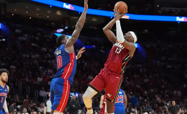 Miami Heat center Bam Adebayo (13) aims to score as Detroit Pistons center Jalen Duren (0) defends during the second half of an NBA basketball game Sunday, March 8, 2026, in Miami. (AP Photo/Marta Lavandier)