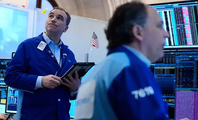 Christopher Lagana works on the floor at the New York Stock Exchange in New York, Tuesday, March 10, 2026. (AP Photo/Seth Wenig)