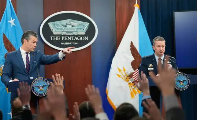 Defense Secretary Pete Hegseth and Chairman of the Joint Chiefs of Staff Gen. Dan Caine take questions during a press briefing at the Pentagon, Monday, March 2, 2026, in Washington. (AP Photo/Mark Schiefelbein)