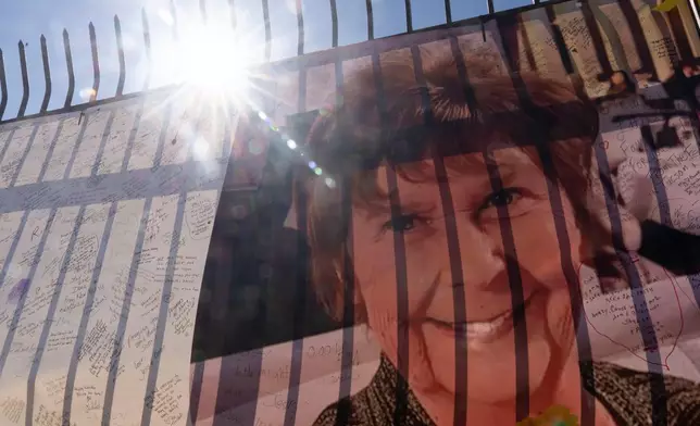 A banner with notes from hundreds of well-wishers and an image of Nancy Guthrie, the missing mother of "Today" show host Savannah Guthrie, outside the KVOA Newsroom in Tucson, Ariz., Friday, March 6, 2026. (AP Photo/Rebecca Noble)