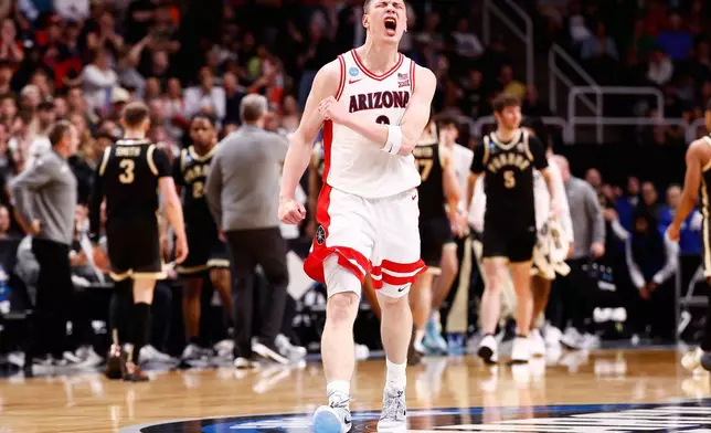Arizona forward Ivan Kharchenkov (8) reacts as Arizona takes a lead over Purdue during the second half in the Elite Eight of the NCAA college basketball tournament, Saturday, March 28, 2026, in San Jose, Calif. (AP Photo/Kelley L Cox)