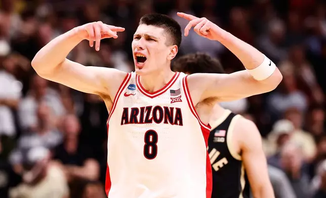 Arizona forward Ivan Kharchenkov reacts after scoring during the second half in the Elite Eight of the NCAA college basketball tournament against Purdue, Saturday, March 28, 2026, in San Jose, Calif. (AP Photo/Kelley L Cox)