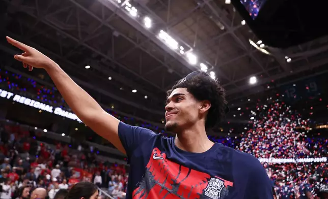 Arizona forward Koa Peat celebrates after a win over Purdue in the Elite Eight of the NCAA college basketball tournament, Saturday, March 28, 2026, in San Jose, Calif. (AP Photo/Kelley L Cox)