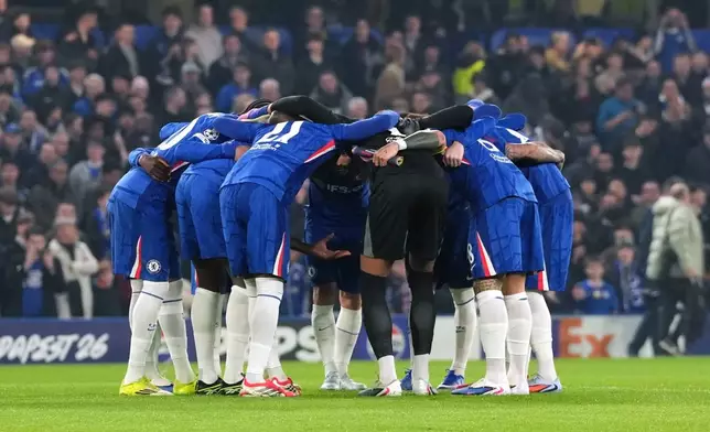 Chelsea players huddle before the Champions League soccer match between Chelsea and Paris Saint-Germain in London, England, Tuesday, March 17, 2026. (Adam Davy/PA via AP)