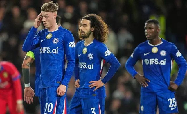 Chelsea's Cole Palmer, Chelsea's Marc Cucurella, Chelsea's Moises Caicedo react during the Champions League soccer match between Chelsea and Paris Saint-Germain in London, England, Tuesday, March 17, 2026. (AP Photo/Kin Cheung)