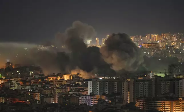 Smoke rises following an Israeli airstrike in the Dahiyeh area of Beirut, Thursday, March 5, 2026. (AP Photo/Hassan Ammar)