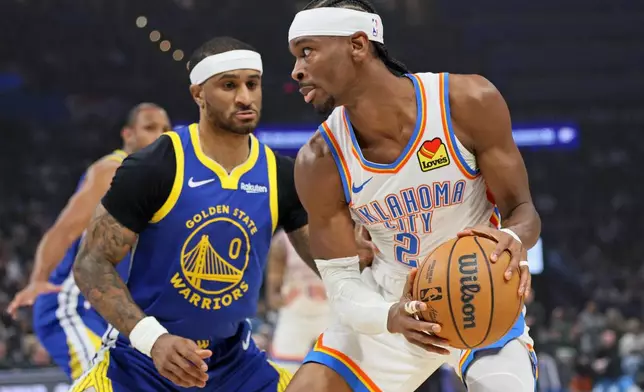 Oklahoma City Thunder guard Shai Gilgeous-Alexander (2) looks for an outlet against Golden State Warriors guard Gary Payton II (0) during the first half of an NBA basketball game Saturday, March 7, 2026, in Oklahoma City. (AP Photo/Nate Billings)