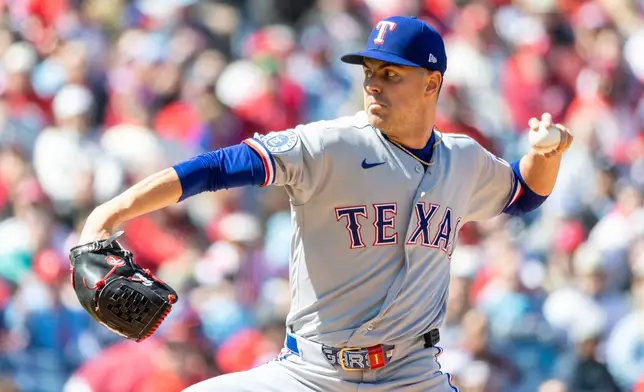 Texas Rangers pitcher MacKenzie Gore throws in the first inning of a baseball game against the Philadelphia Phillies, Sunday, March 29, 2026, in Philadelphia. (AP Photo/Laurence Kesterson)
