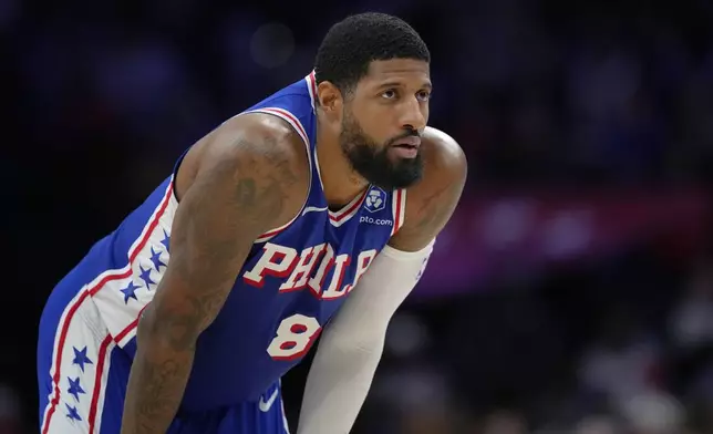 FILE - Philadelphia 76ers' Paul George looks on during a break in play during an NBA basketball game Thursday, Jan. 29, 2026, in Philadelphia. (AP Photo/Matt Slocum, File)