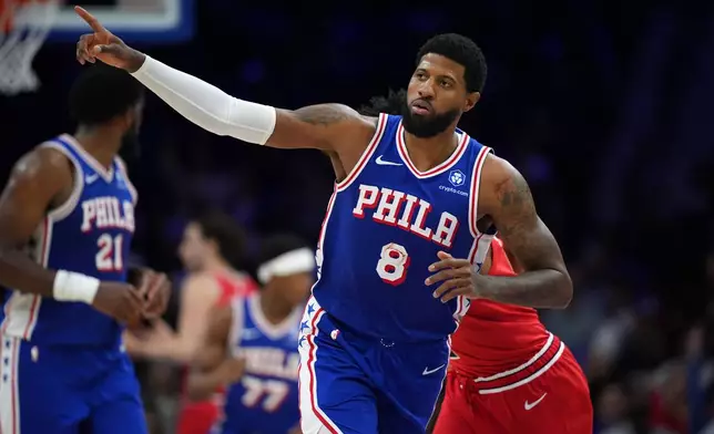 Philadelphia 76ers' Paul George reacts after making a three-point shot during the second half of an NBA basketball game against the Chicago Bulls Wednesday, March 25, 2026, in Philadelphia. (AP Photo/Matt Slocum)