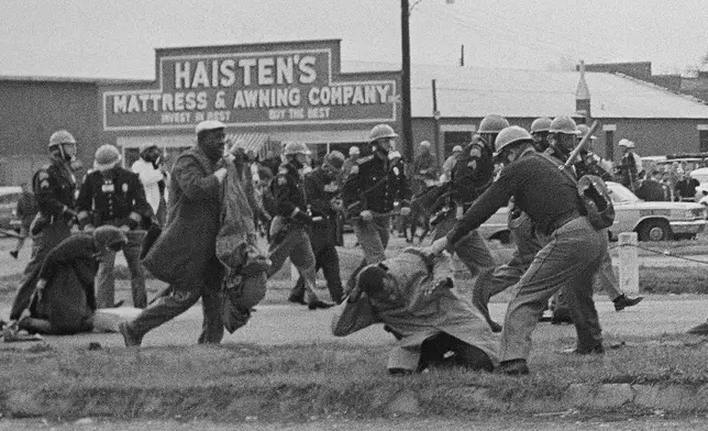 FILE - State troopers hit protesters with billy clubs to break up a civil rights voting march in Selma, Ala., on Sunday, March 7, 1965. (AP Photo/File)