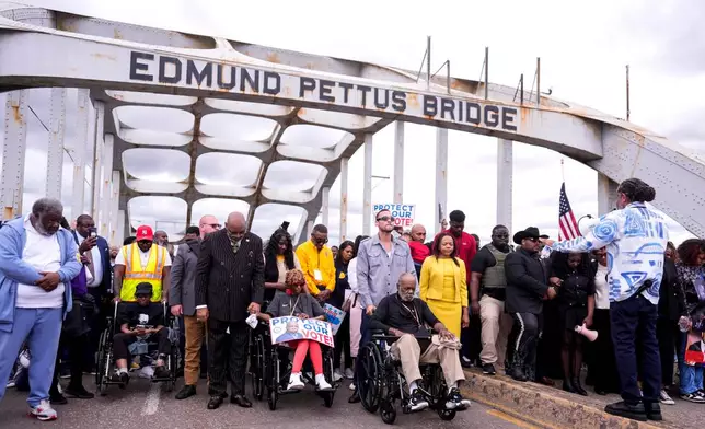 People march over the Edmund Pettus Bridge on the 61st Bloody Sunday Anniversary, Sunday, March 8, 2026, in Selma, Ala. (AP Photo/Mike Stewart)