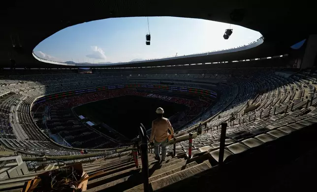 Workers renovate the Azteca Stadium during a press tour ahead of the 2026 World Cup, in Mexico City, Thursday, March 26, 2026. (AP Photo/Marco Ugarte)