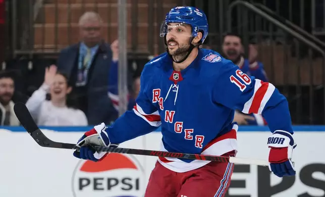 New York Rangers' Vincent Trocheck (16) reacts after scoring a goal during the shootout of an NHL hockey game against the Pittsburgh Penguins Saturday, Feb. 28, 2026, in New York. (AP Photo/Frank Franklin II)