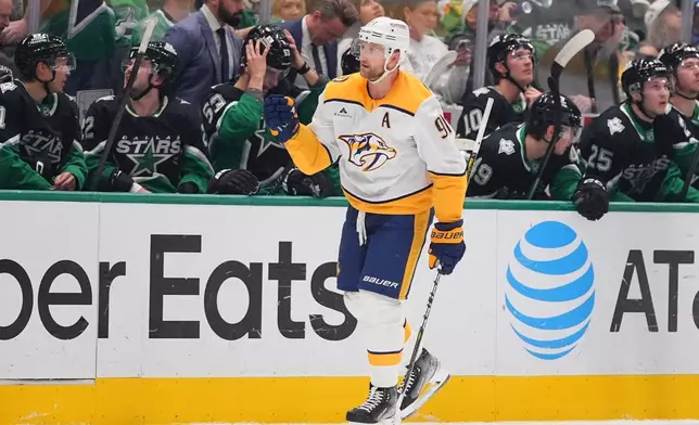 Nashville Predators center Steven Stamkos (91) skates past the Dallas Stars bench after scoring a goal during the first period of an NHL hockey game Saturday, Feb. 28, 2026, in Dallas. (AP Photo/LM Otero)