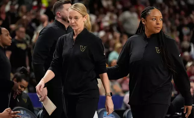 Vanderbilt head coach Shea Ralph leaves the game after being ejected during second half of an NCAA college basketball game against Mississippi in the quarterfinals of the Southeastern Conference tournament, Friday, March 6, 2026, in Greenville, S.C. (AP Photo/Chris Carlson)