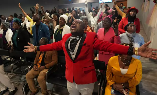 FILE - Jean-Michel Gisnel cries out while praying with other congregants at the First Haitian Evangelical Church of Springfield, Jan. 26, 2025, in Springfield, Ohio. (AP Photo/Luis Andres Henao, file)