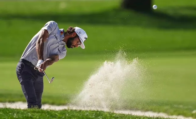 Akshay Bhatia hits from the bunker on the first hole during the first round of the Arnold Palmer Invitational at Bay Hill golf tournament Thursday, March 5, 2026, in Orlando, Fla. (AP Photo/Matt Slocum)