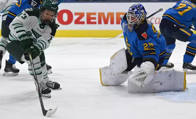 Boston Fleet's Liz Schepers (13) shoots on goal against Toronto Sceptres goaltender Elaine Chuli (29) during first-period PWHL hockey game action in Toronto, Friday, March 27, 2026. (Jon Blacker/The Canadian Press via AP)