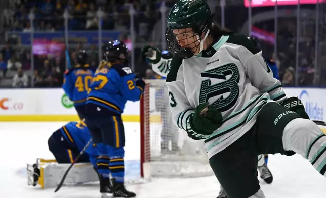 Boston Fleet's Liz Schepers (13) celebrates after scoring against Toronto Sceptres goaltender Elaine Chuli, left, during first-period PWHL hockey game action in Toronto, Friday, March 27, 2026. (Jon Blacker/The Canadian Press via AP)