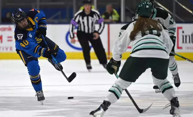 Toronto Sceptres' forward Blayre Turnbull (40) shoots the puck into the Boston Fleet zone during second period of an PWHL hockey game against the Toronto Sceptres in Toronto on Friday, March 27, 2026. (Jon Blacker/The Canadian Press via AP)