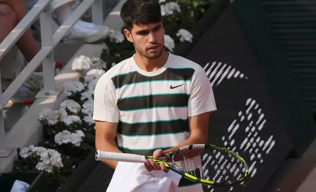 FILE - Spain's Carlos Alcaraz towels off during the final of the French Open tennis tournament against Italy's Jannik Sinner, Sunday, June 8, 2025, in Paris. (AP Photo/Aurelien Morissard, File)