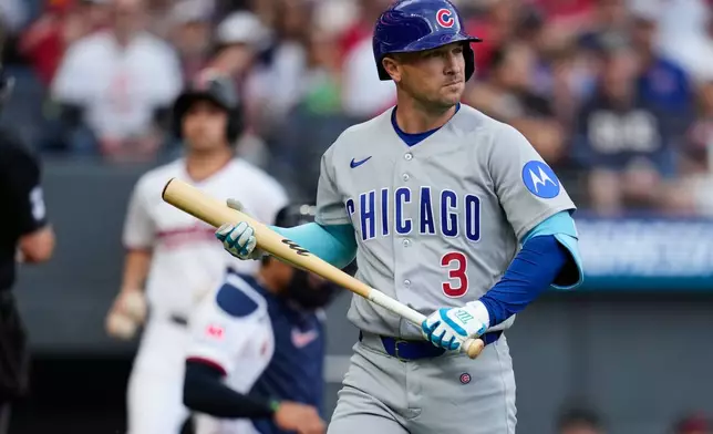 Chicago Cubs' Alex Bregman walks to the dugout after striking out in the first inning of a baseball game against the Cleveland Guardians in Cleveland, Friday, April 3, 2026. (AP Photo/Sue Ogrocki)