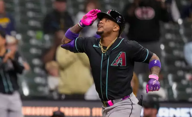 Arizona Diamondbacks' Ketel Marte celebrates as he rounds the bases on a single home run during the ninth inning of a baseball game against the Milwaukee Brewers Wednesday, April 29, 2026, in Milwaukee. (AP Photo/Andy Manis)