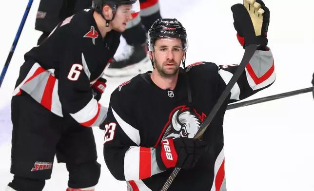 Buffalo Sabres defenseman Mattias Samuelsson (23) celebrates victory following the third period of an NHL hockey game against the Tampa Bay Lightning, Monday, April 6, 2026, in Buffalo, N.Y. (AP Photo/Jeffrey T. Barnes)