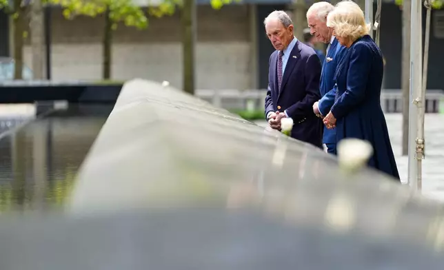 From left, former New York City Mayor Michael Bloomberg, Britain's King Charles III and Queen Camilla visit the 9/11 Memorial, Wednesday, April 29, 2026, in New York. (AP Photo/Yuki Iwamura, Pool)