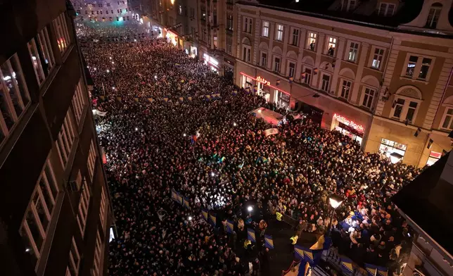 An aerial view shows fans celebrating after the Bosnian national team qualified for the World Cup by winning a penalty shootout against Italy, in Sarajevo, Bosnia, Wednesday, April 1, 2026. (AP Photo/Armin Durgut)