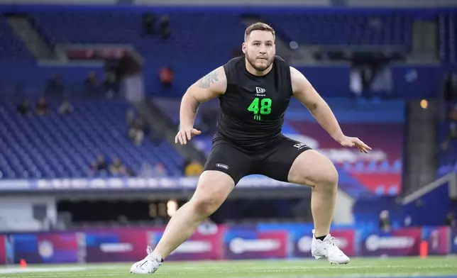 FILE - Iowa offensive lineman Beau Stephens (48) runs a drill at the NFL football scouting combine in Indianapolis, Sunday, March 1, 2026. (AP Photo/Michael Conroy,File)