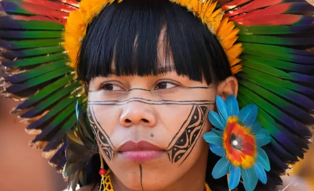A Xakriaba Indigenous woman attends a march during the annual "Acampamento Terra Livre," or Free Land Encampment, Brazil's largest annual Indigenous mobilization that focuses on land rights and environmental protection, in Brasilia, Brazil, Tuesday, April 7, 2026. (AP Photo/Eraldo Peres)