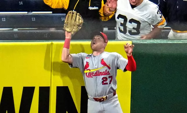 St. Louis Cardinals left fielder Nathan Church (27) leaps to make the catch on a fly ball by Pittsburgh Pirates' Nick Gonzales to end the baseball game in Pittsburgh, Wednesday, April 29, 2026. (AP Photo/Gene J. Puskar)