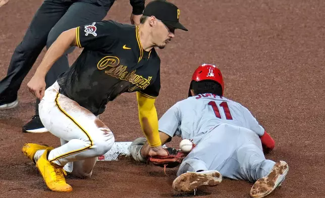 St. Louis Cardinals' Victor Scott II (11) steals second base as the ball gets away from Pittsburgh Pirates shortstop Konnor Griffin during the seventh inning of a baseball game in Pittsburgh, Wednesday, April 29, 2026. (AP Photo/Gene J. Puskar)