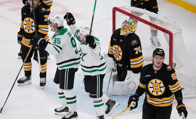 Dallas Stars center Matt Duchene (95) celebrates after his goal against Boston Bruins goaltender Joonas Korpisalo (70) during the second period of an NHL hockey game, Tuesday, March 31, 2026, in Boston. (AP Photo/Charles Krupa)