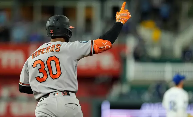 Baltimore Orioles' Leody Taveras celebrates after hitting a grand slam during the 12th inning of a baseball game against the Kansas City Royals, Monday, April 20, 2026, in Kansas City, Mo. (AP Photo/Charlie Riedel)