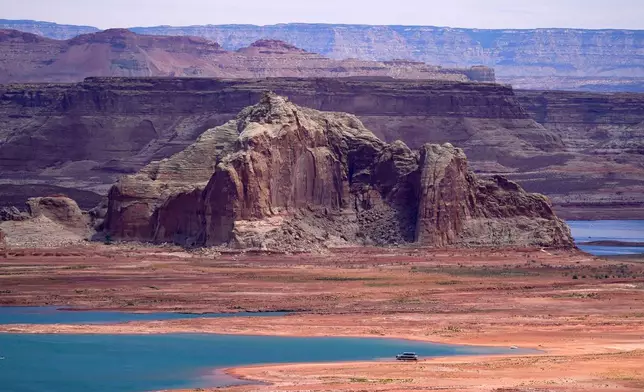 FILE - Low water levels at Wahweap Bay at Lake Powell, along the Upper Colorado River Basin are shown, June 9, 2021, at the Utah and Arizona border at Wahweap, Ariz. (AP Photo/Ross D. Franklin, File)