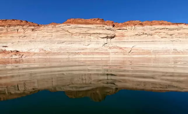 FILE - Bathtub rings show how low Lake Powell levels have declines, June 8, 2022, in Page, Ariz. (AP Photo/Brittany Peterson, File)