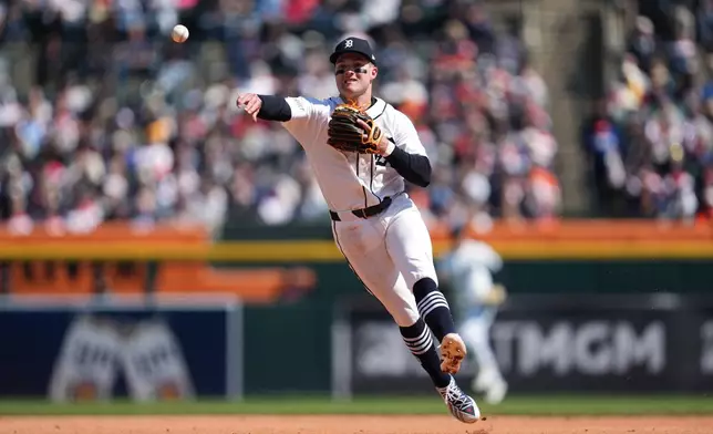 Detroit Tigers shortstop Kevin McGonigle throws to first base for an out on a Miami Marlins' Graham Pauley ground ball during the sixth inning of a baseball game Saturday, April 11, 2026, in Detroit. (AP Photo/Paul Sancya)