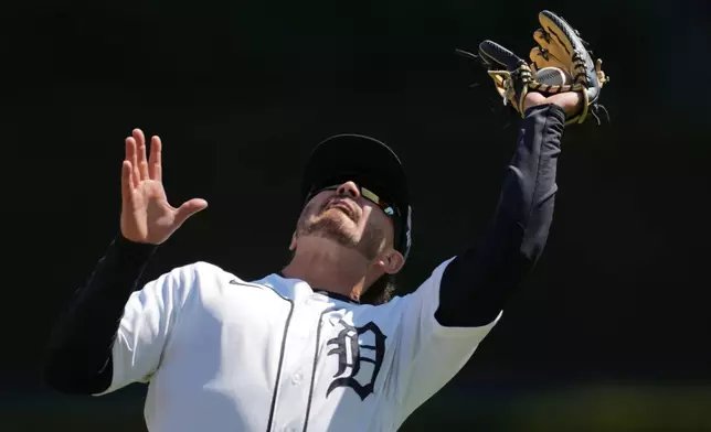 Detroit Tigers second baseman Zach McKinstry catches a Miami Marlins' Agustín Ramírez fly ball during the fifth inning of a baseball game Saturday, April 11, 2026, in Detroit. (AP Photo/Paul Sancya)