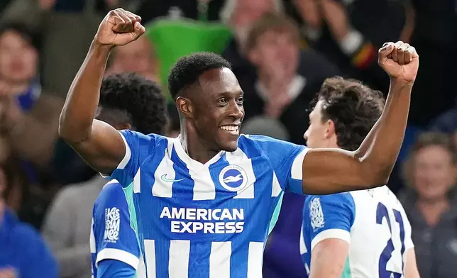 Brighton and Hove Albion's Danny Welbeck celebrates scoring their third goal during the Premier League soccer match between Brighton and Hove Albion and Chelsea, Tuesday, April 21 2026, in Brighton, England. (Gareth Fuller/PA via AP)
