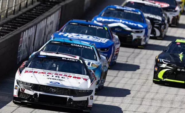 Ryan Blaney (12) leads Ross Chastain and the rest of the field during the start of a NASCAR Cup Series auto race, Sunday, April 12, 2026, in Bristol, Tenn. (AP Photo/Wade Payne)